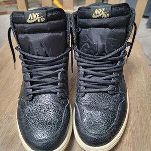 Nike Air Jordan 1 Retro High OG "City of Flight" sneaker in black, metallic gold